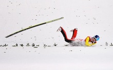 Немецкий прыгун с трамплина Зеверин Фройнд © 2014 Getty Images фото 16