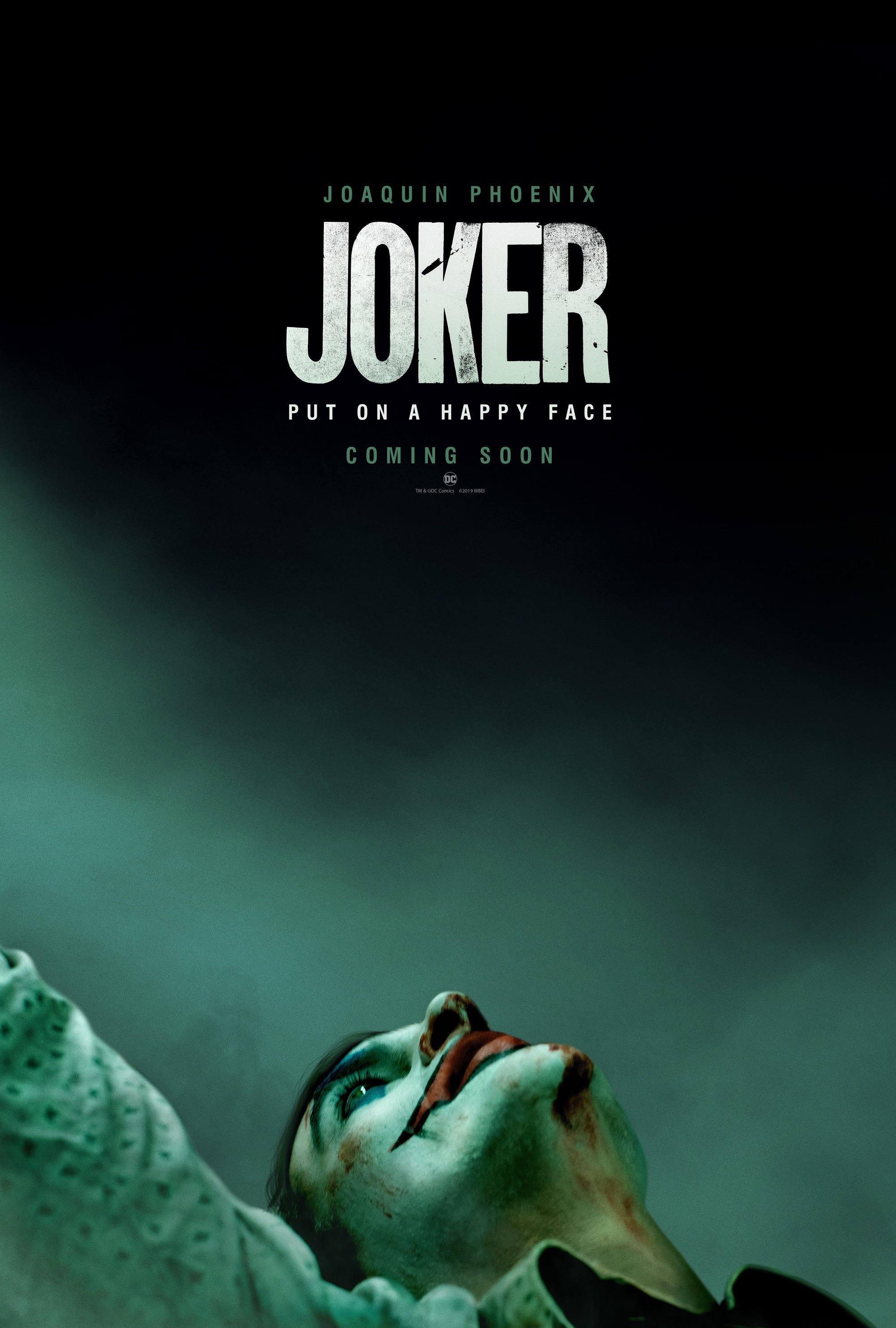 Хоакин Феникс в образе Клоуна-Принца преступного мира на постере криминального фильма «Джокер»